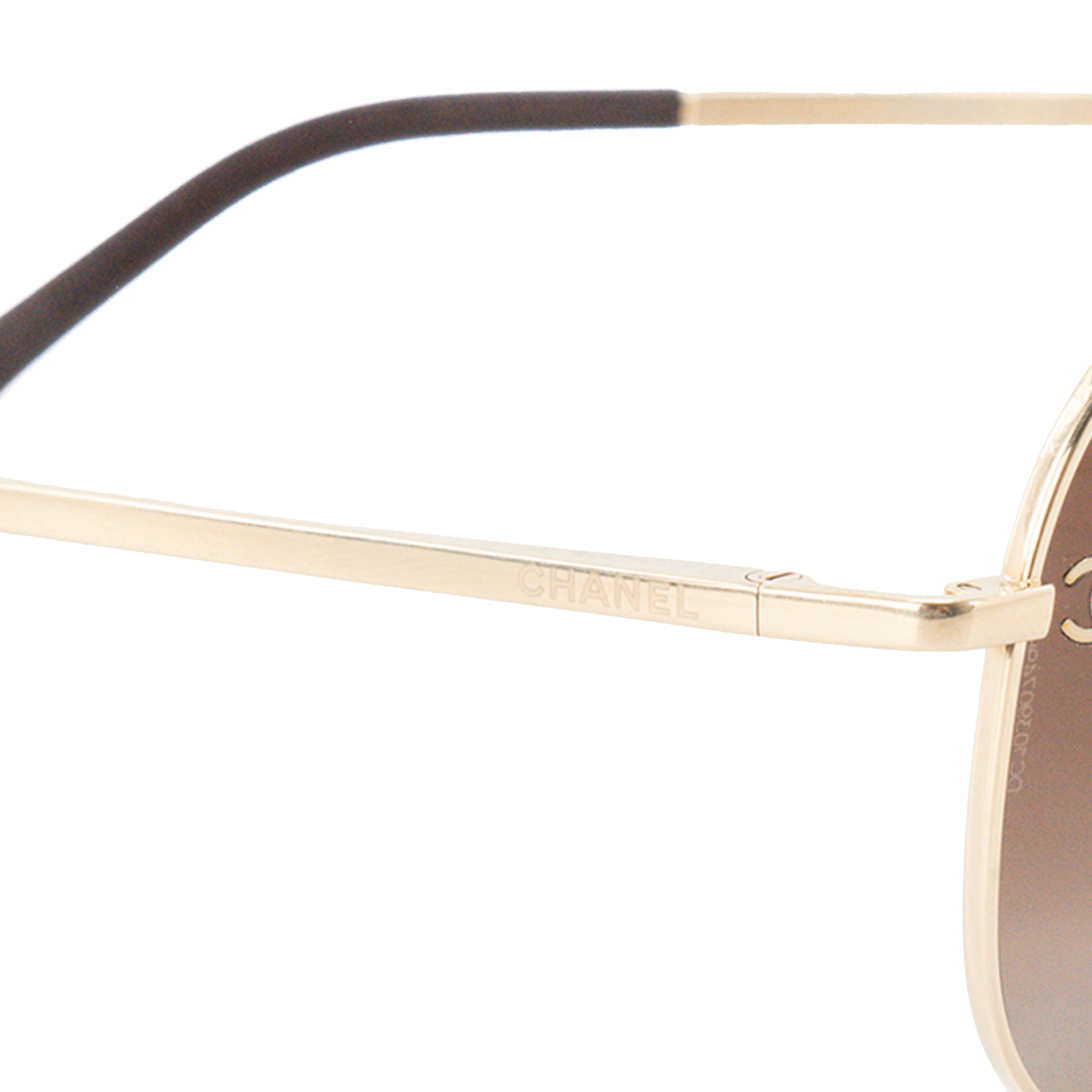CHANEL - Lunettes de soleil Chanel en métal doré