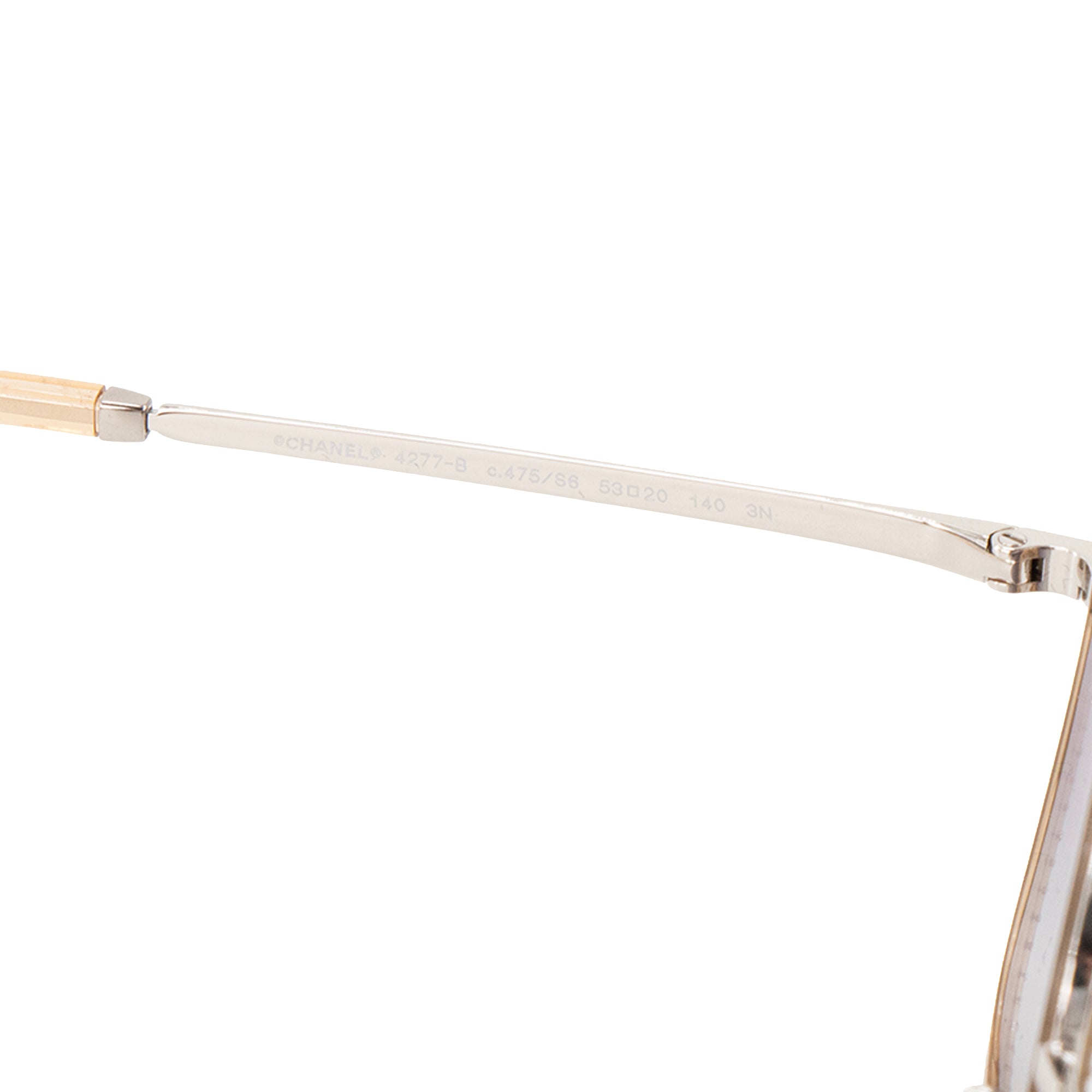 CHANEL - Lunettes de soleil Chanel en métal argenté et strass