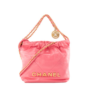 CHANEL - Sac à bandoulière Chanel 22 mini en cuir lisse rose