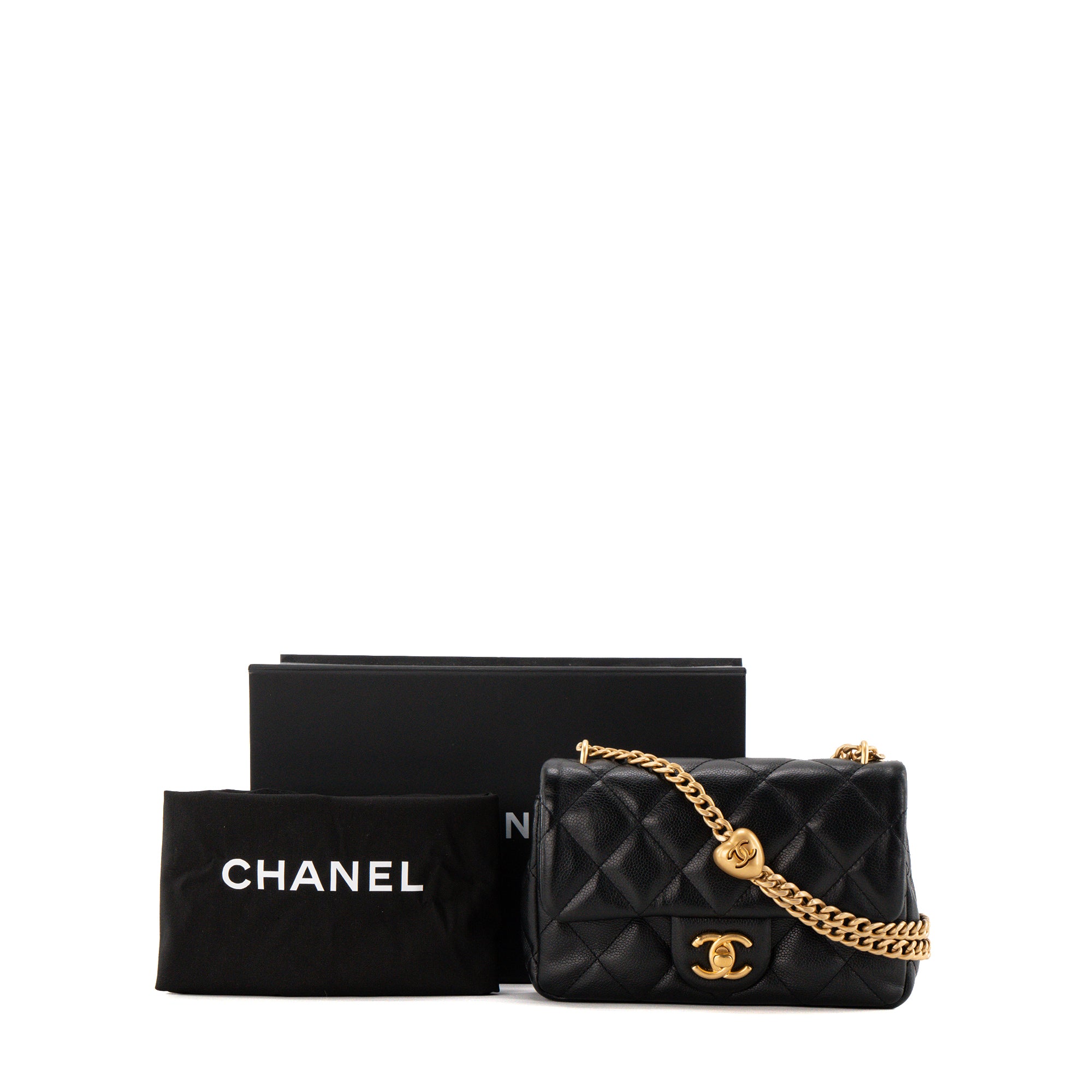 CHANEL - Sac à bandoulière Classique/Timeless Heart Crush Chanel en cuir grainé noir