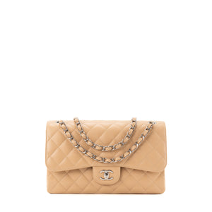 CHANEL - Sac à bandoulière Classique/Timeless Jumbo Chanel en cuir caviar beige