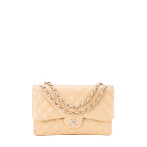 CHANEL - Sac à bandoulière Classique/Timeless Jumbo Chanel en cuir caviar beige
