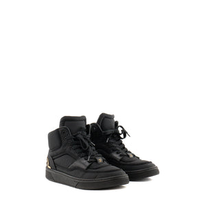 CHANEL - Sneakers Chanel en toile et cuir lisse noir (T37,5)