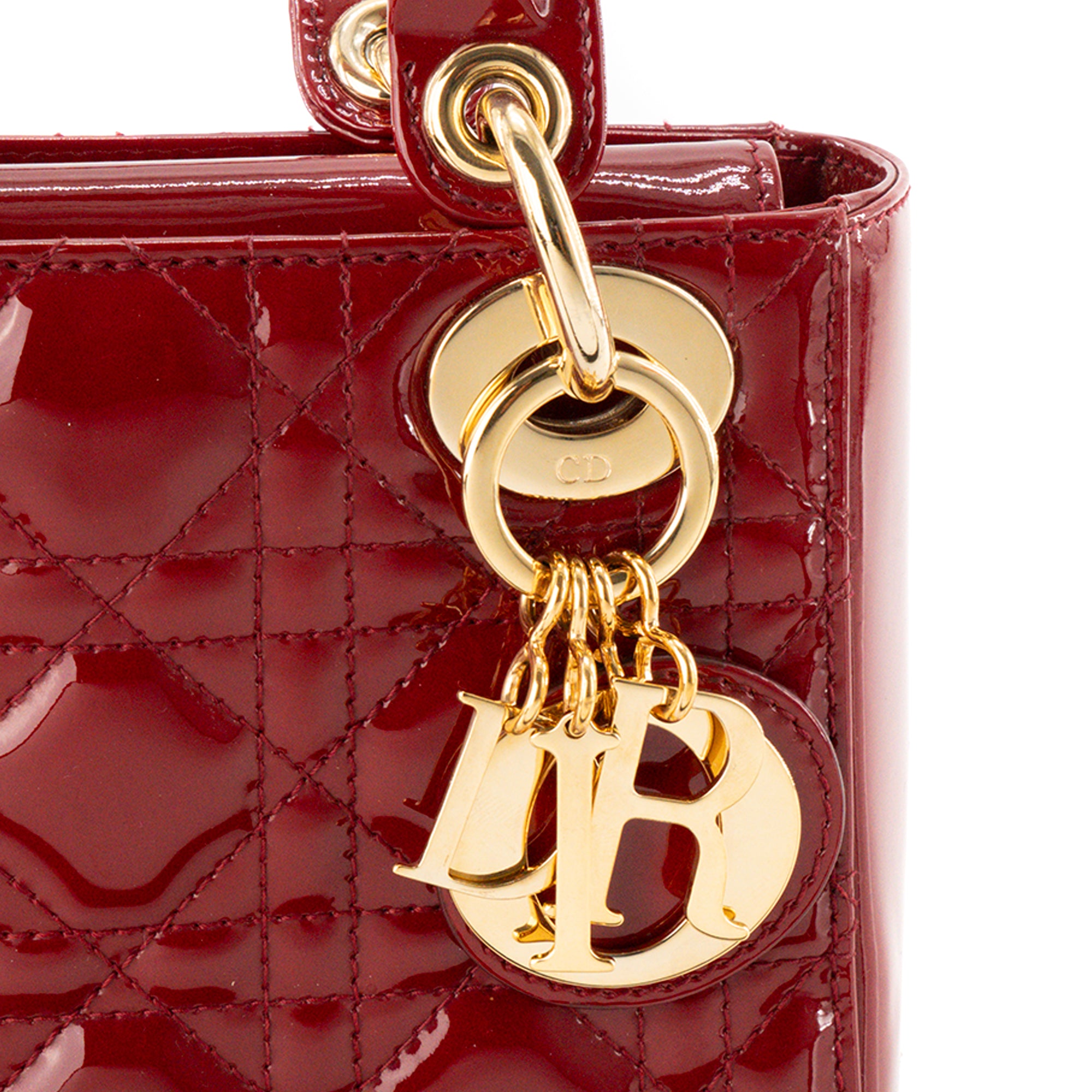 DIOR - Sac à bandoulière Lady Dior Mini en cuir cannage verni bordeaux
