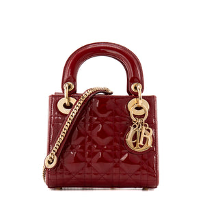 DIOR - Sac à bandoulière Lady Dior mini en cuir cannage verni bordeaux