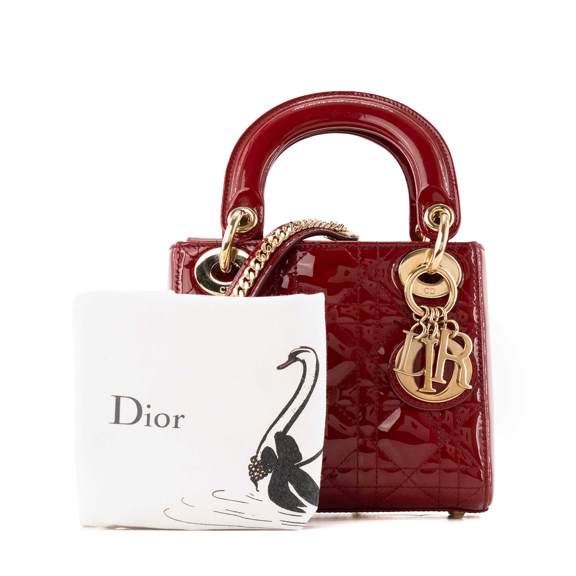 DIOR - Sac à bandoulière Lady Dior mini en cuir cannage verni bordeaux