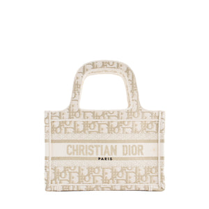 DIOR - Sac à main Book Tote Mini Dior en toile de jouy dorée et blanche