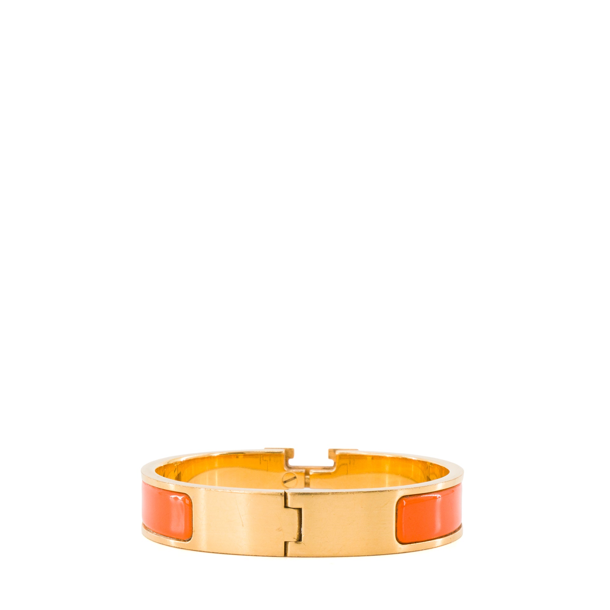 HERMÈS - Bracelet Clic H Hermès en métal doré et émail orange (PM)