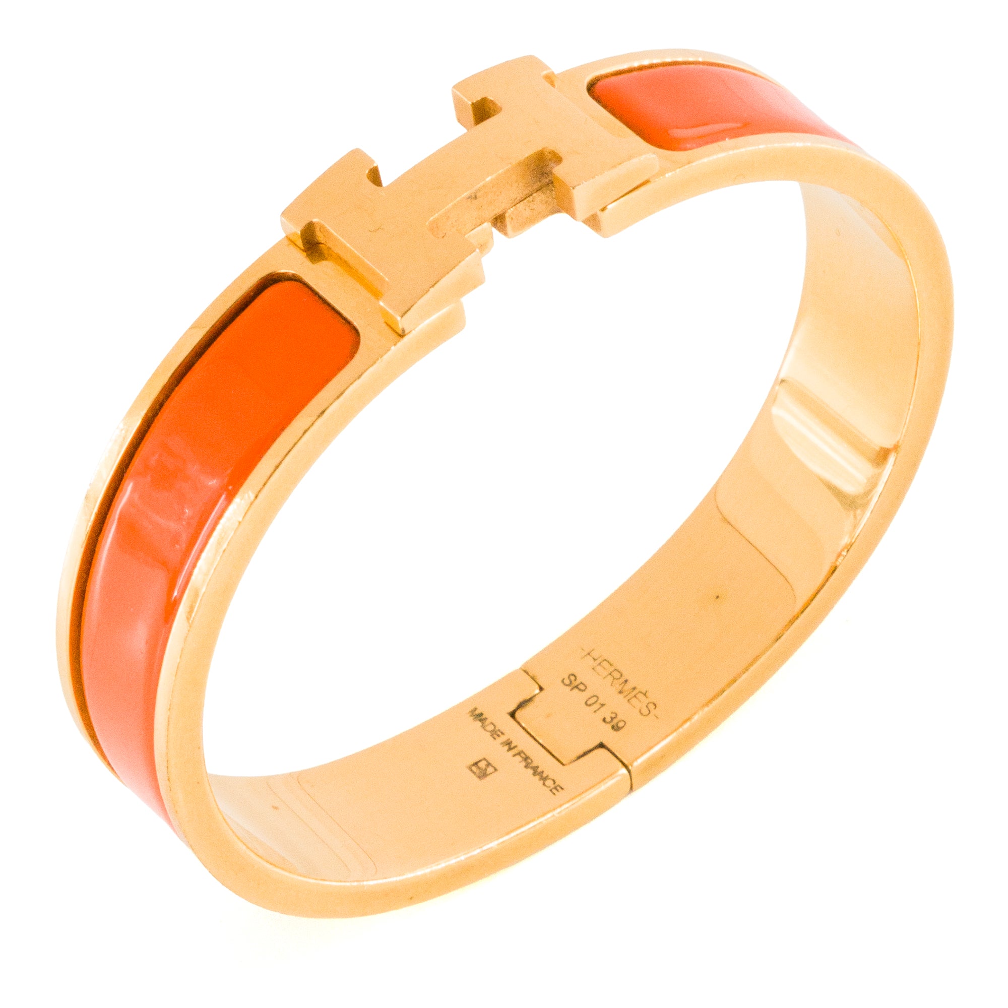 HERMÈS - Bracelet Clic H Hermès en métal doré et émail orange (PM)
