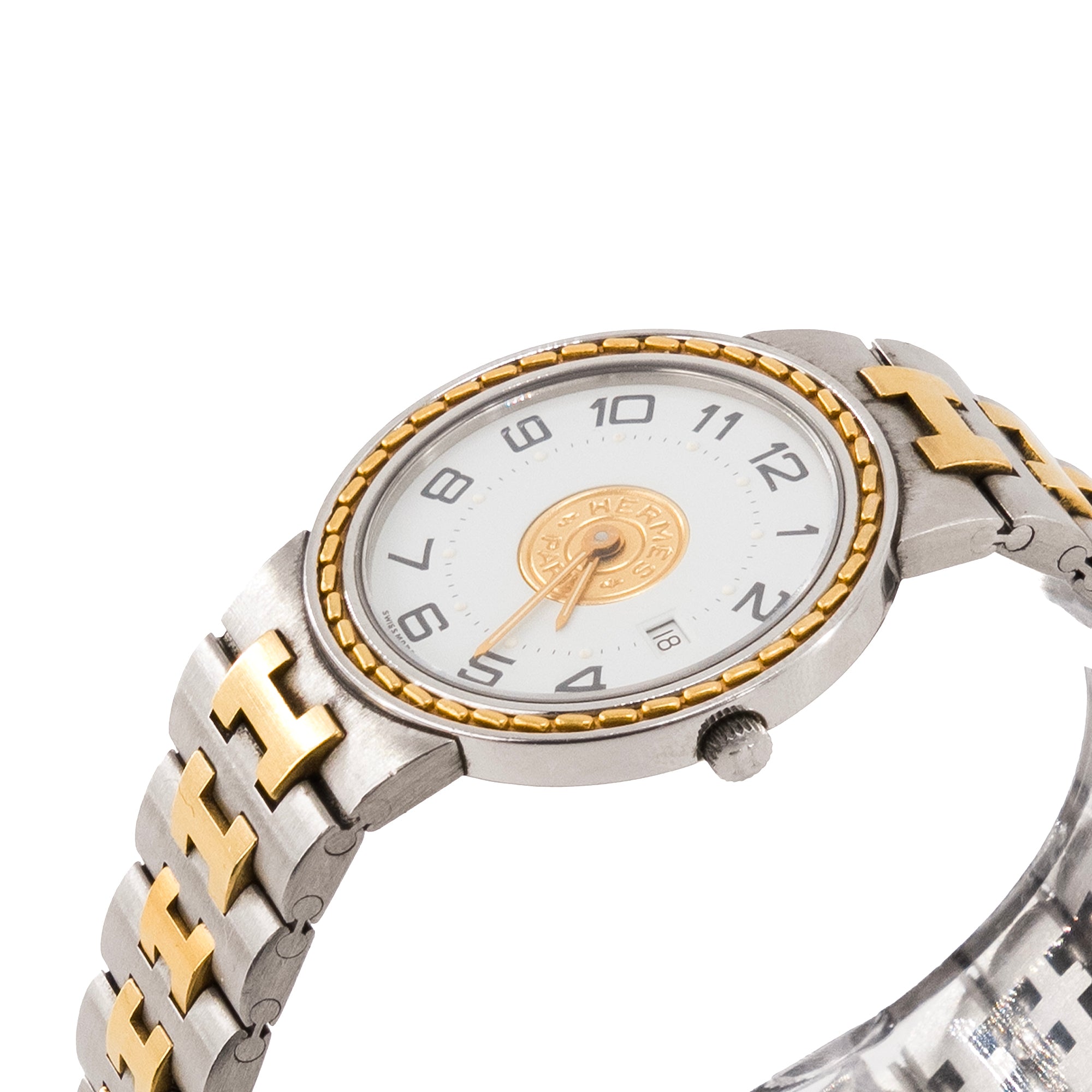 HERMÈS - Montre Sellier Hermès en acier argenté et doré