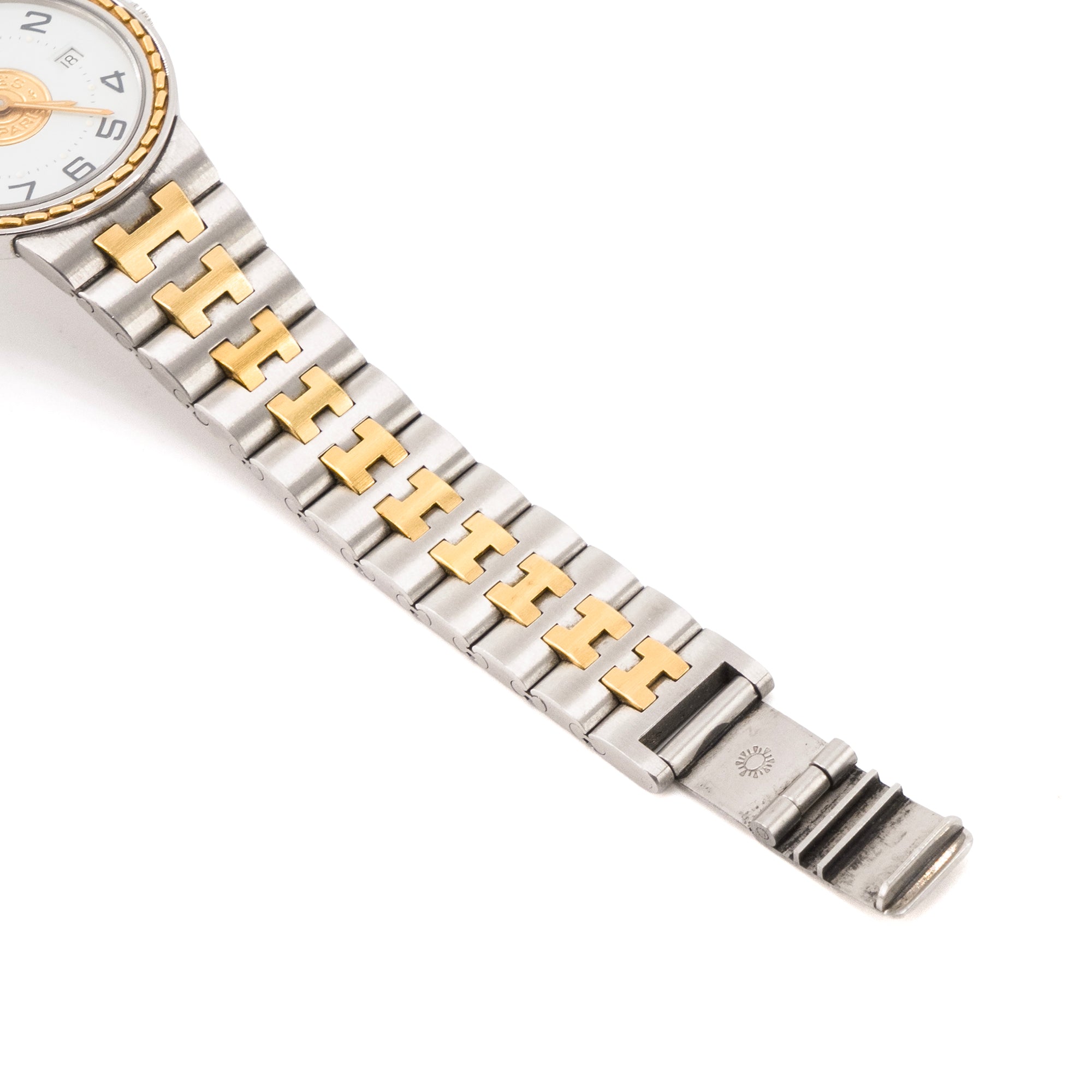 HERMÈS - Montre Sellier Hermès en acier argenté et doré