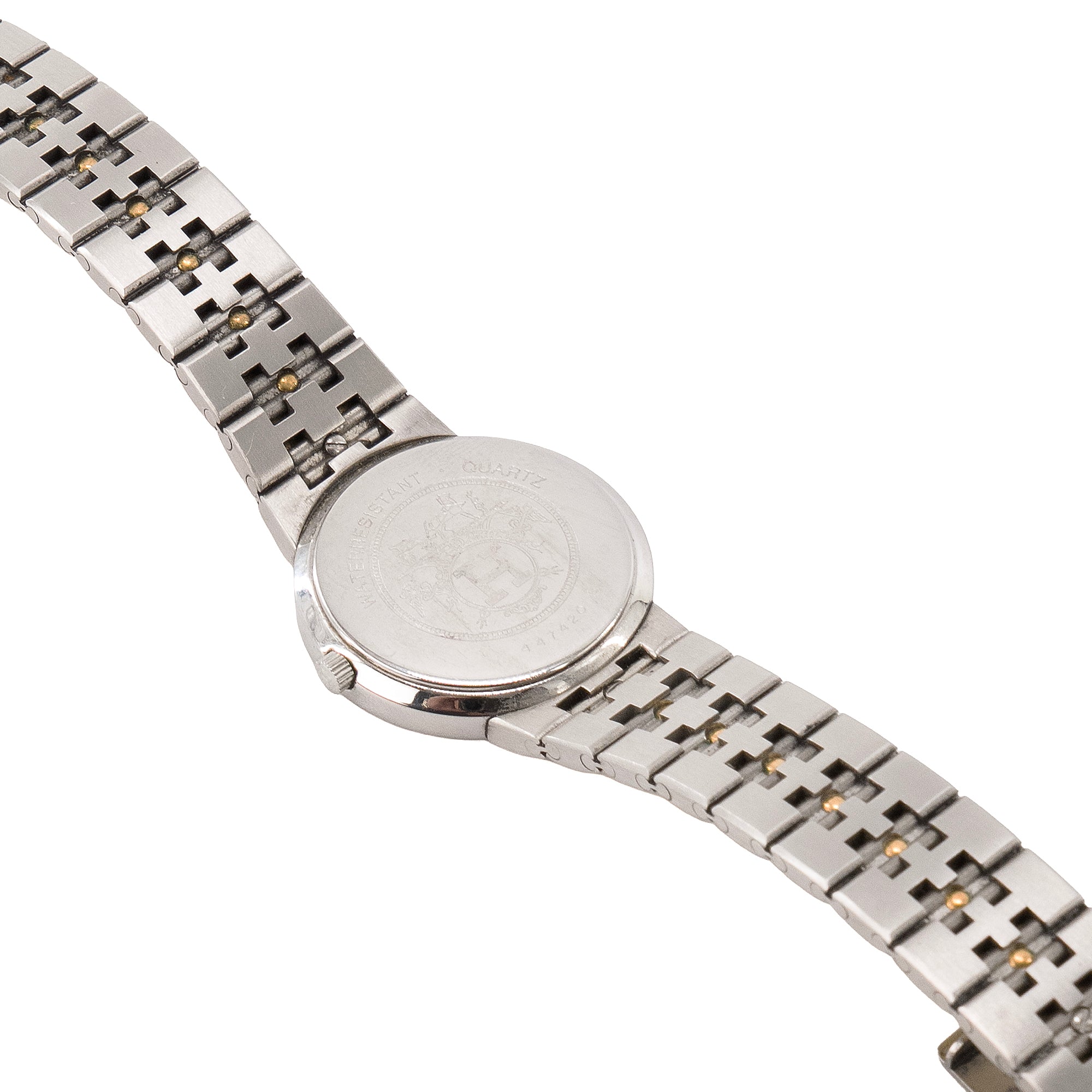 HERMÈS - Montre Sellier Hermès en acier argenté et doré