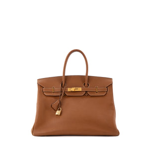 HERMÈS - Sac à main Birkin 35 Hermès en cuir clémence gold