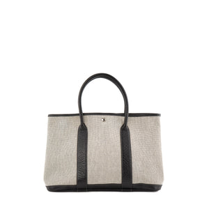 HERMÈS - Sac à main Garden Party Hermès en toile grise et cuir noir