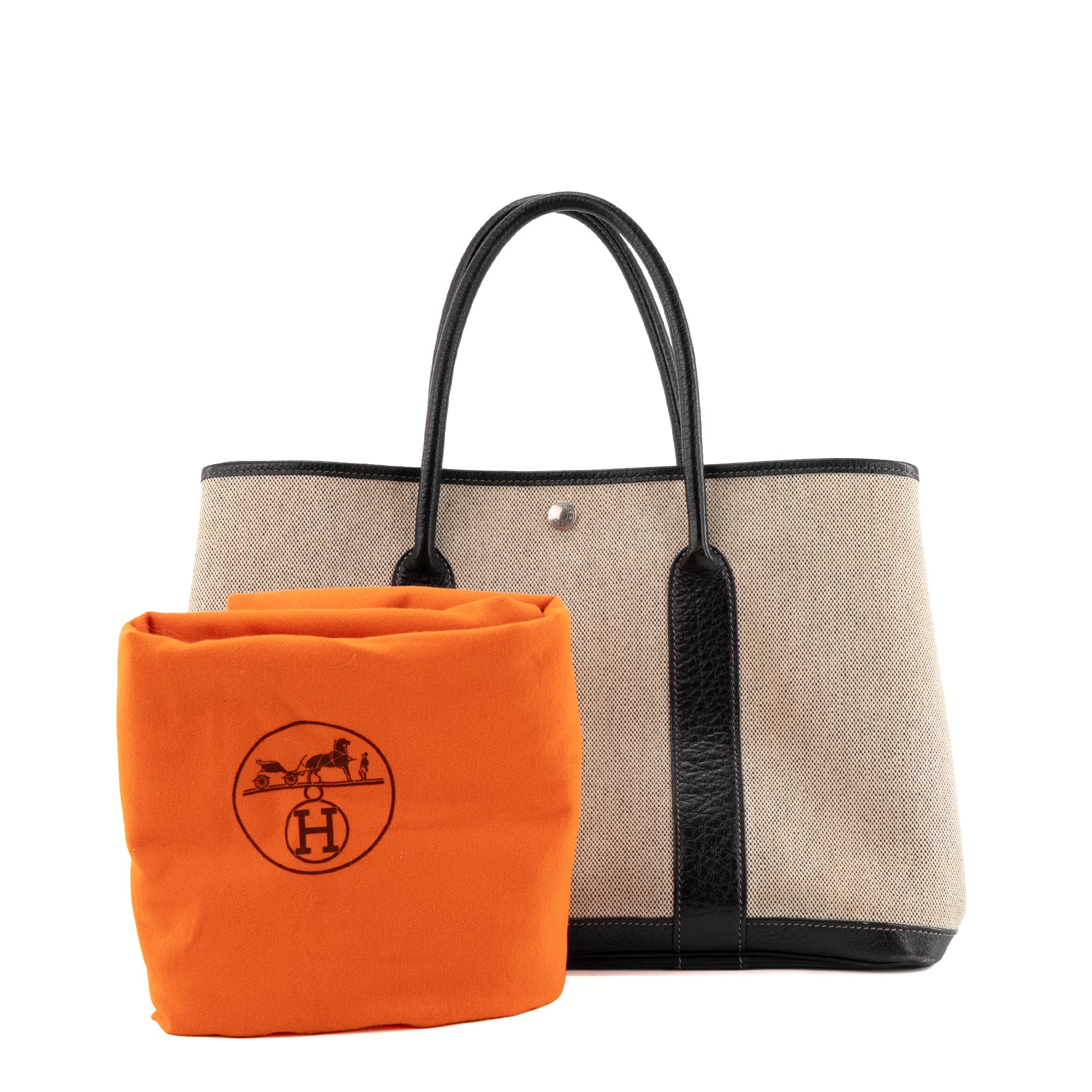 HERMÈS - Sac à main Garden Party Hermès en toile crème et cuir noir