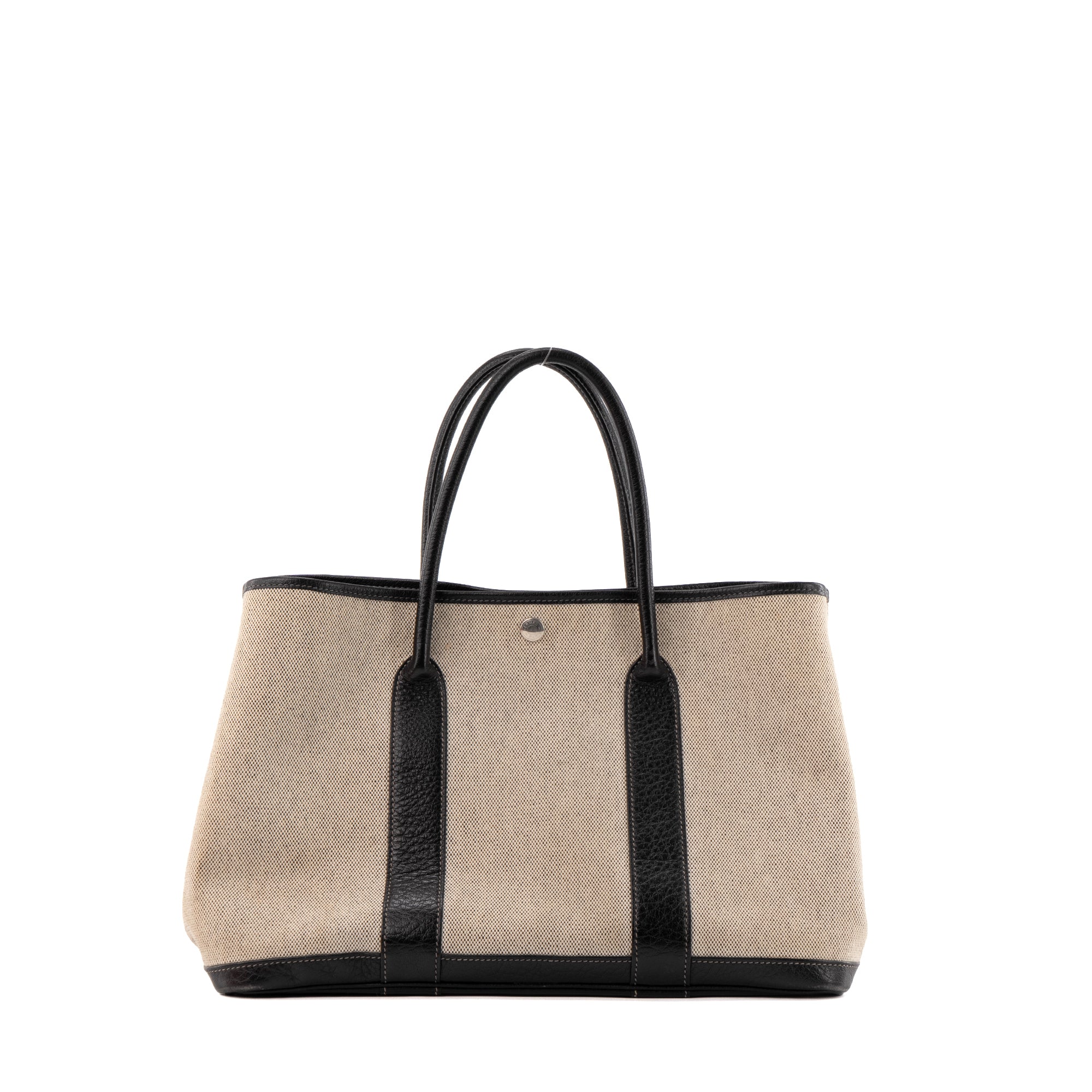 HERMÈS - Sac à main Garden Party Hermès en toile crème et cuir noir