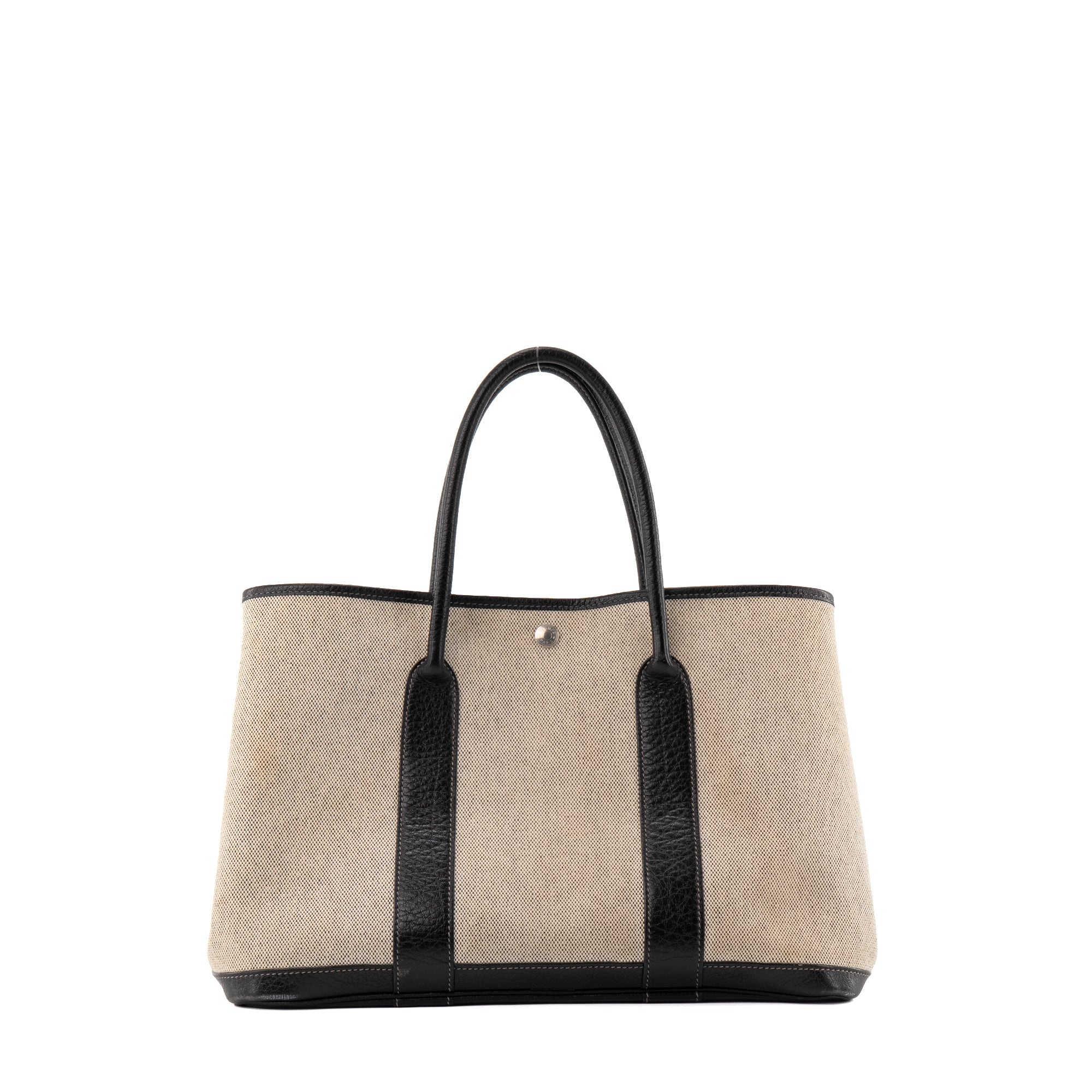 HERMÈS - Sac à main Garden Party Hermès en toile crème et cuir noir