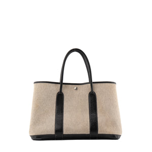 HERMÈS - Sac à main Garden Party Hermès en toile crème et cuir noir