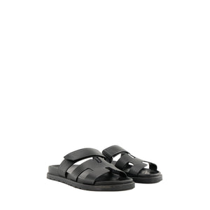 HERMÈS - Sandales Chypre Hermès en cuir lisse noir (T34,5)