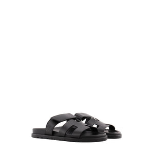 HERMÈS - Sandales Chypre Hermès en cuir noir (T37.5)