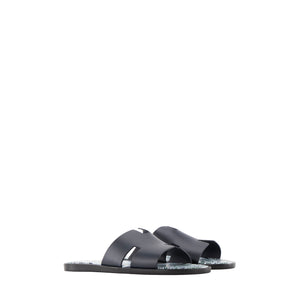 HERMÈS - Sandales Izmir Hermès en cuir lisse bleu marine (T43)