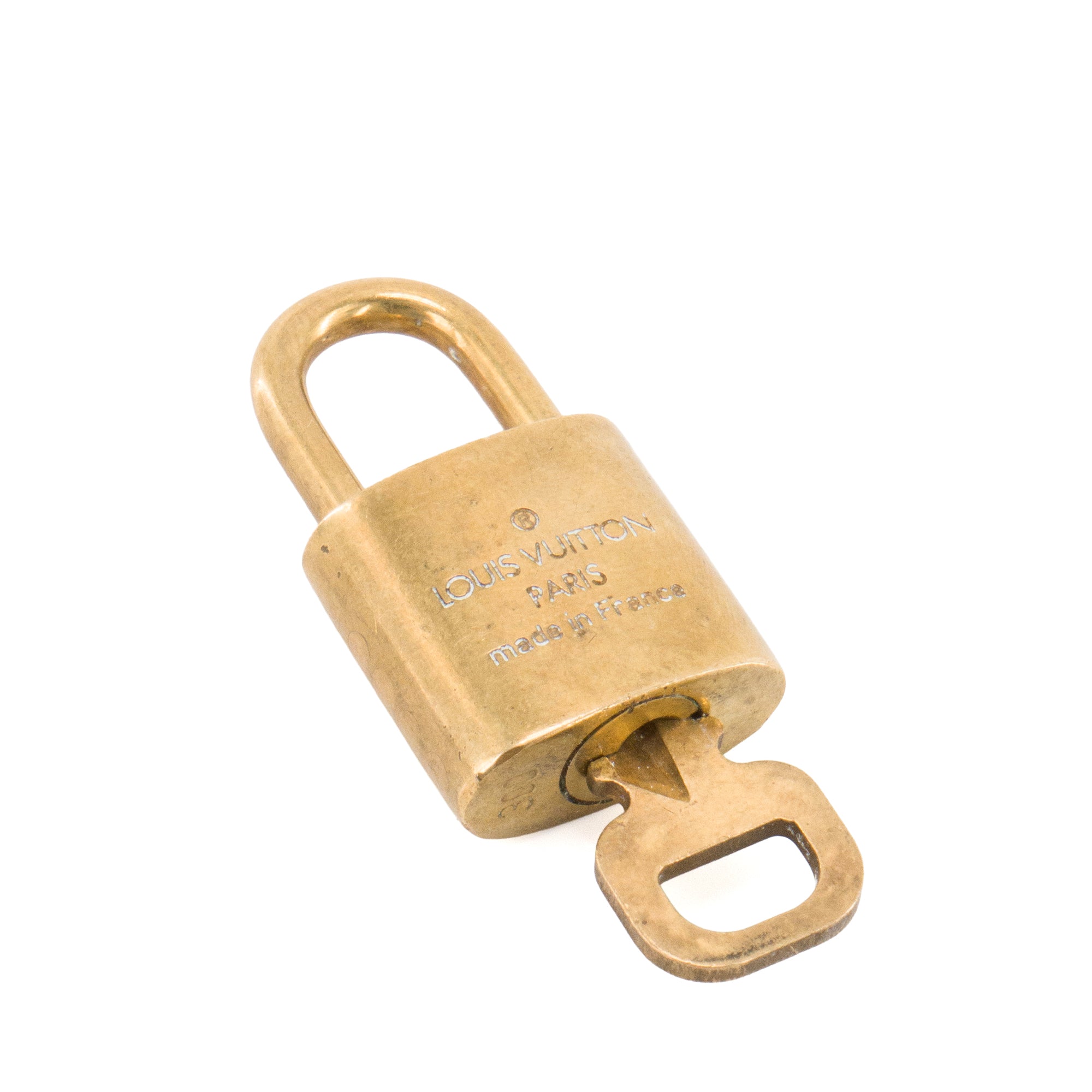 LOUIS VUITTON - Cadenas avec clé Louis Vuitton en métal doré