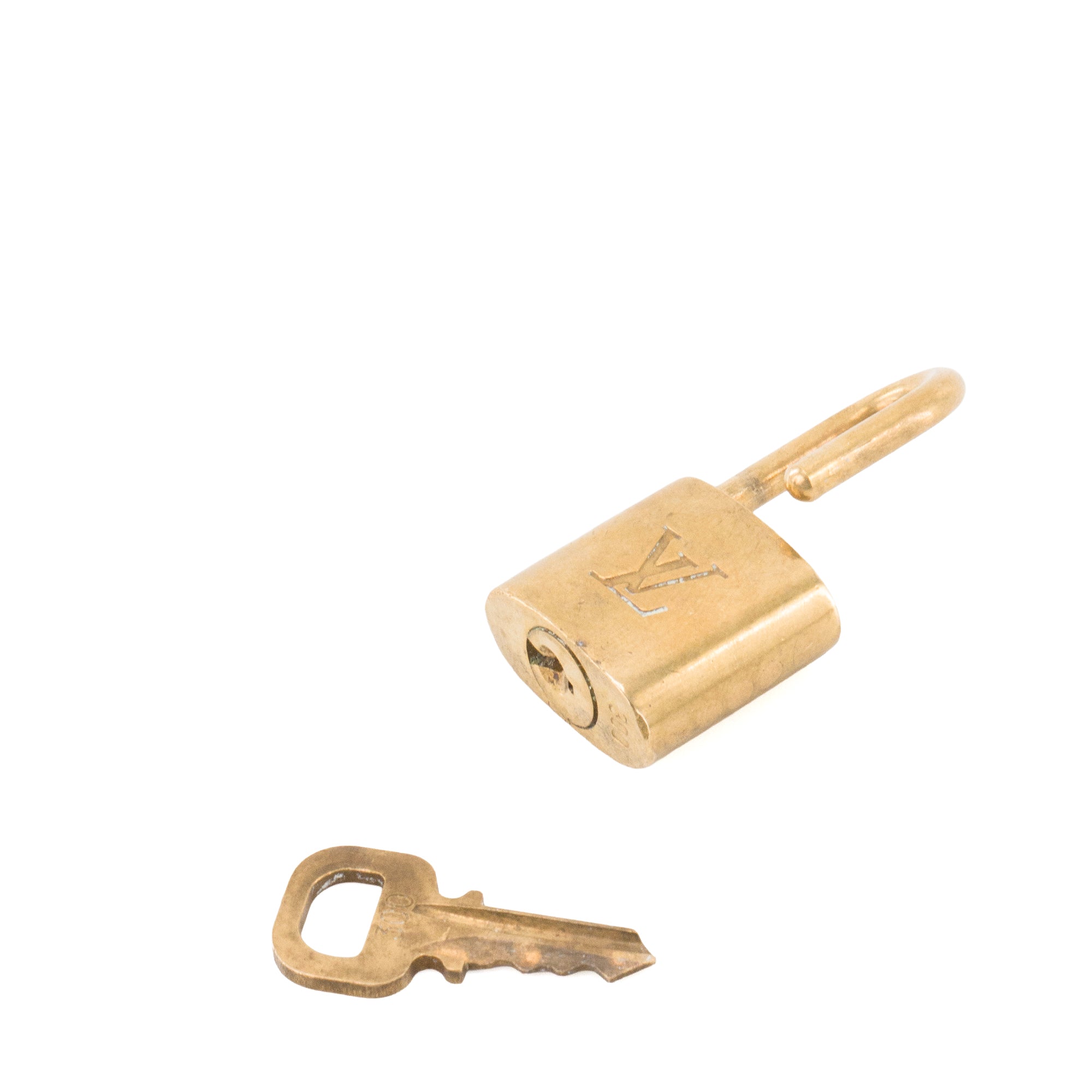 LOUIS VUITTON - Cadenas avec clé Louis Vuitton en métal doré