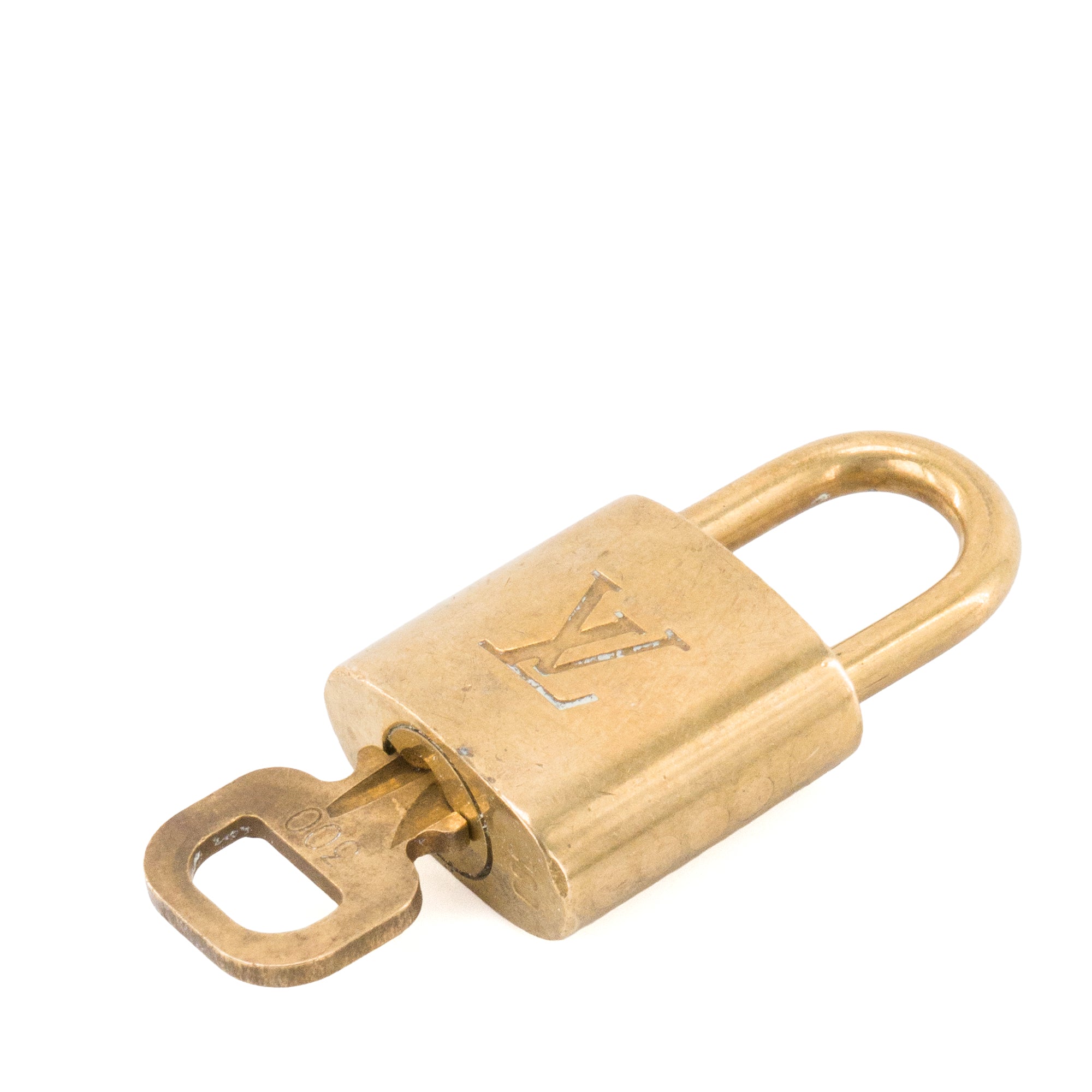 LOUIS VUITTON - Cadenas avec clé Louis Vuitton en métal doré