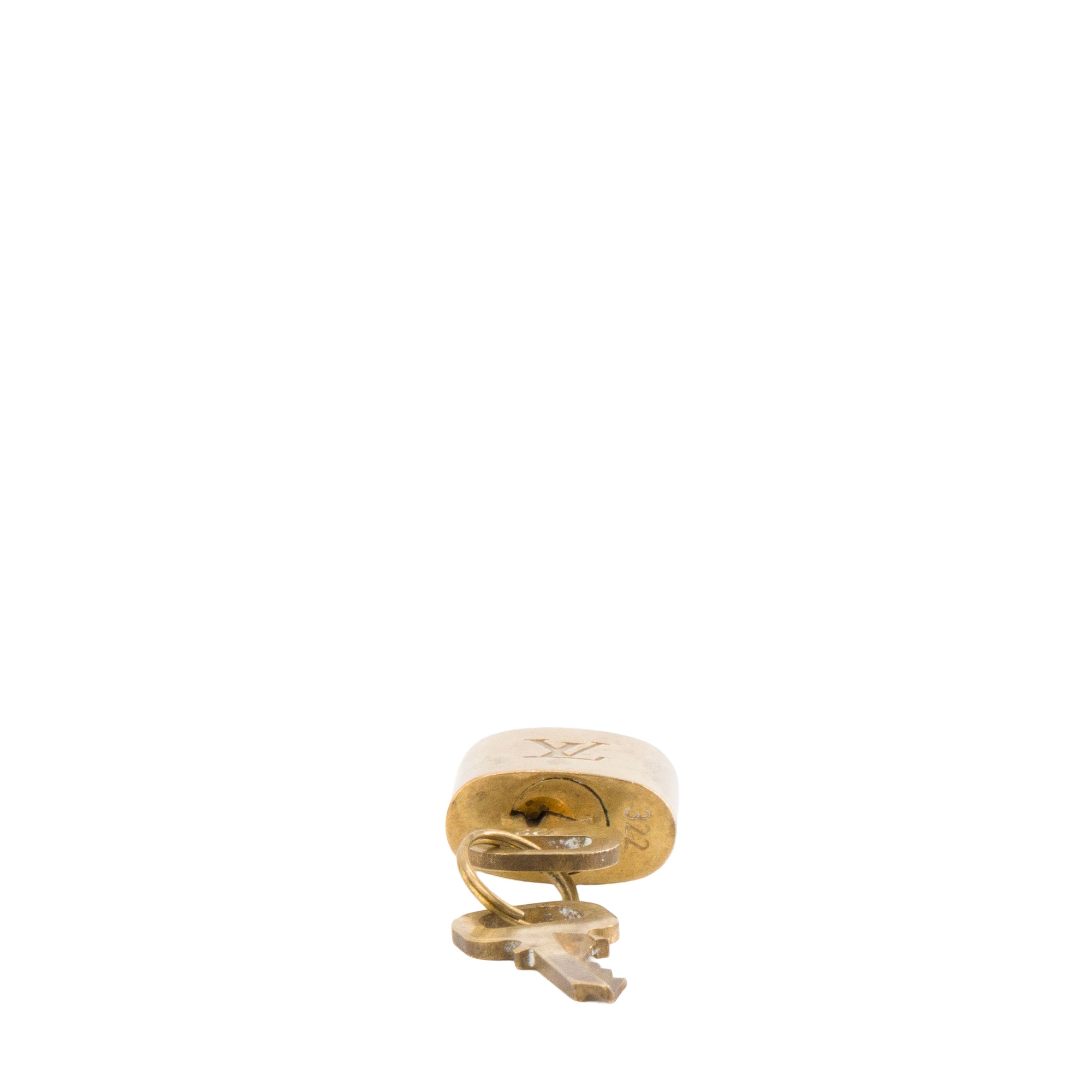 LOUIS VUITTON - Louis Vuitton padlock with key in gold-tone metal
