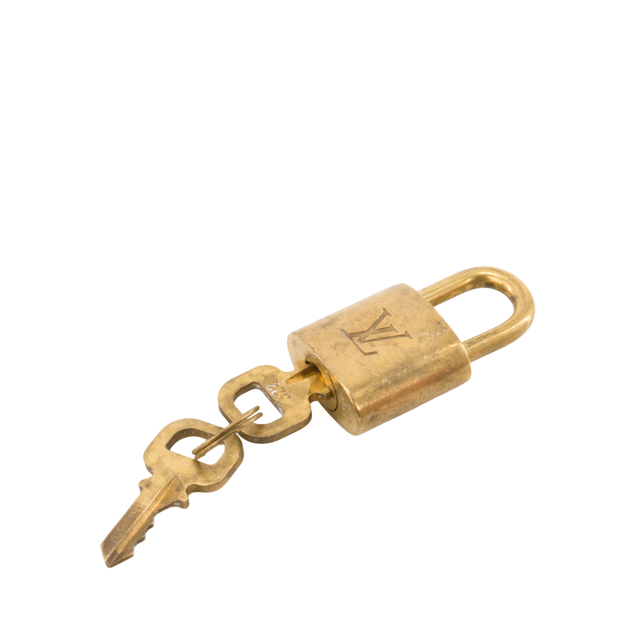 LOUIS VUITTON - Louis Vuitton padlock with key in gold-tone metal