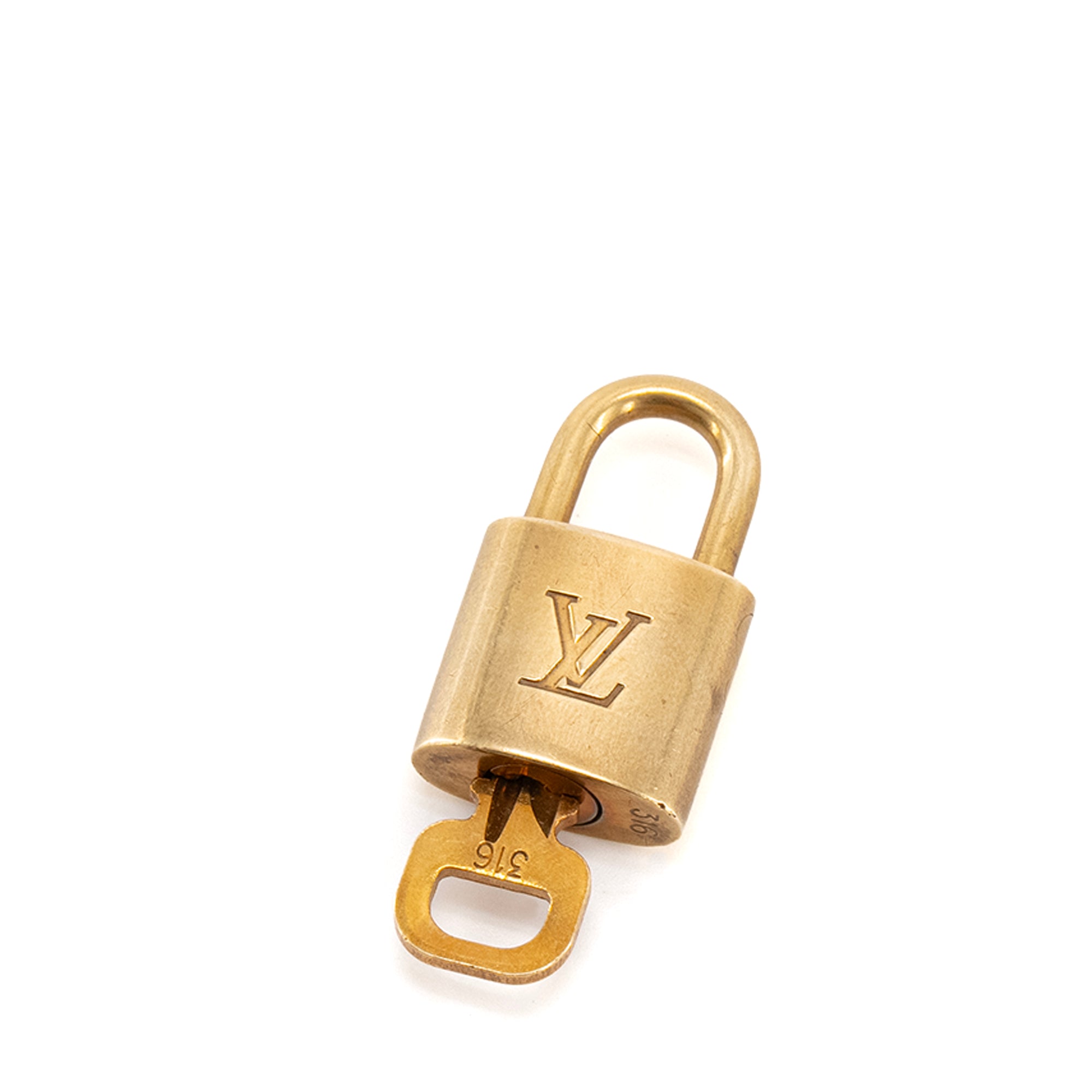 LOUIS VUITTON - Cadenas et clé Louis Vuitton en métal doré