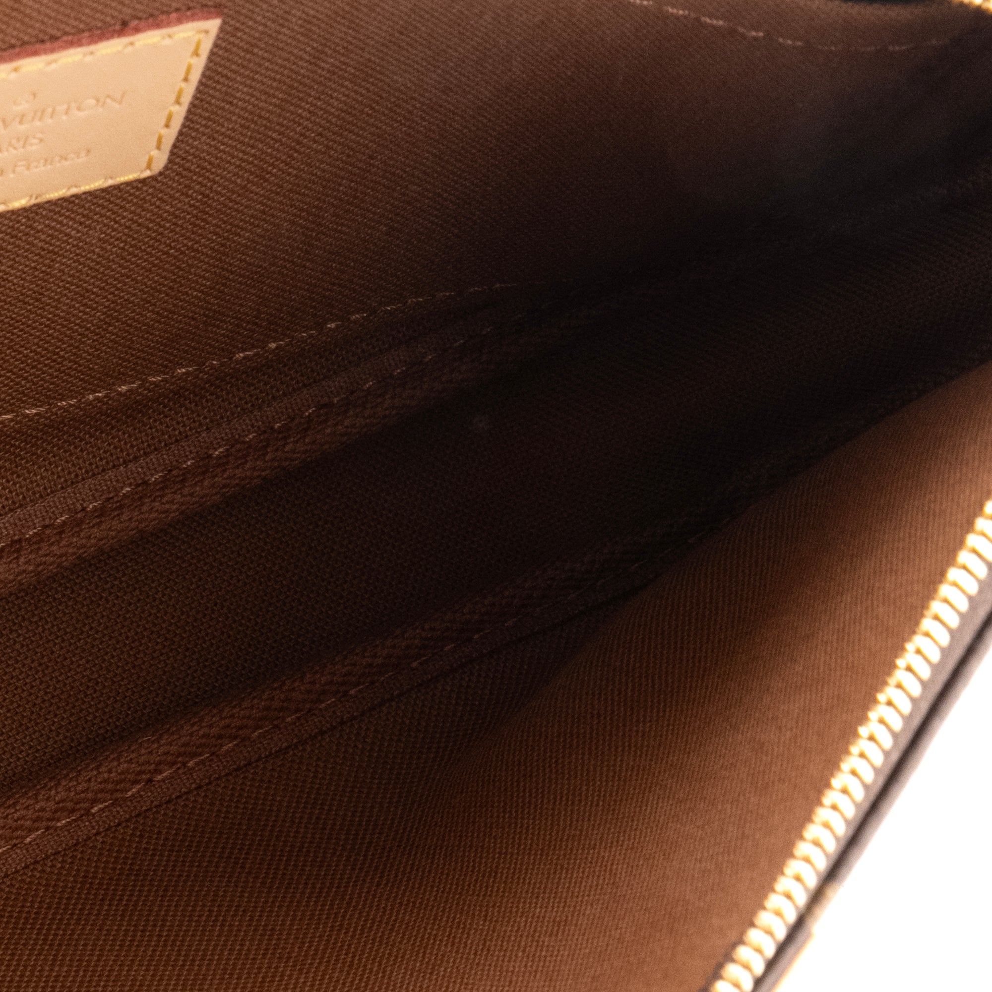 LOUIS VUITTON - Pochette Accessoires Louis Vuitton en toile enduite monogrammée