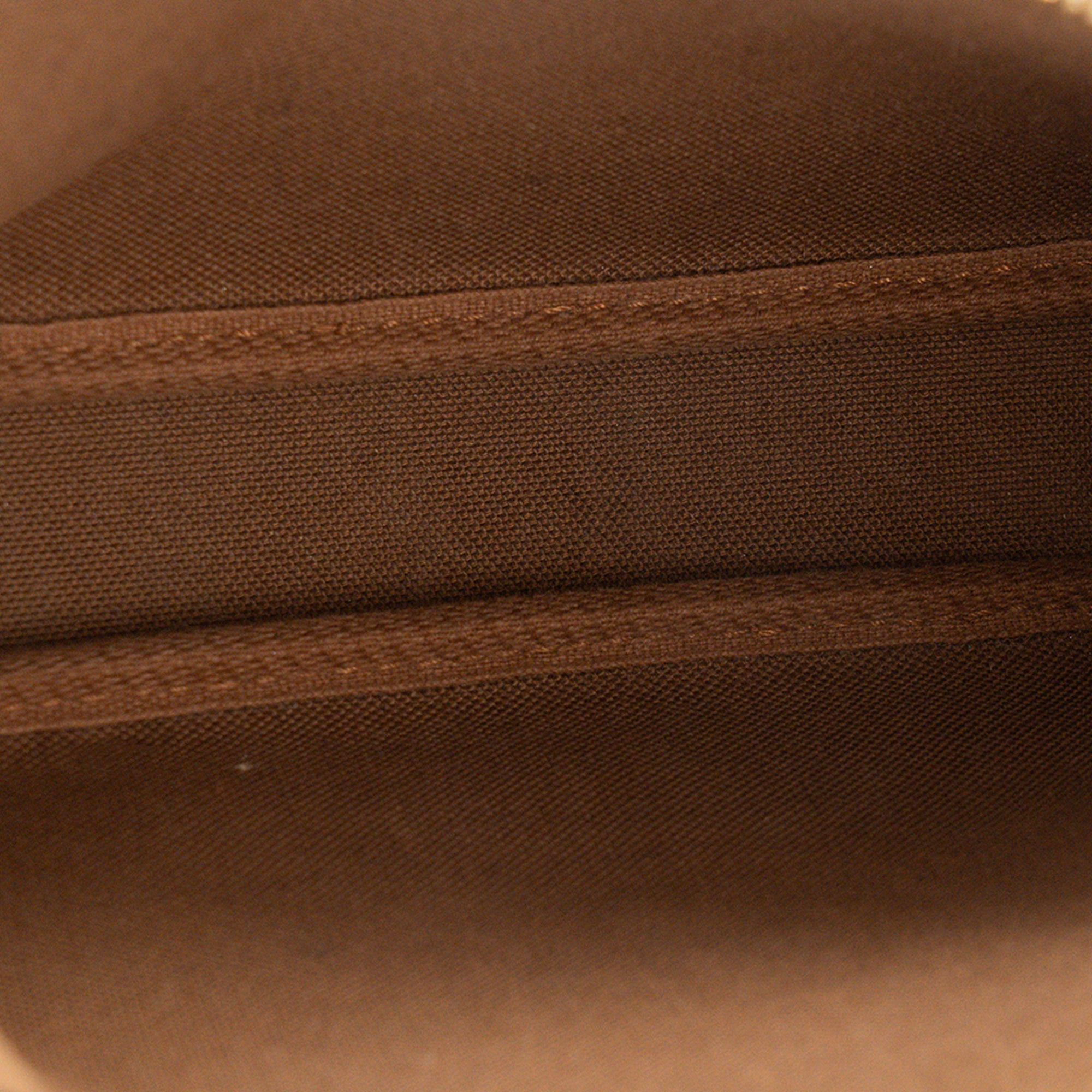 LOUIS VUITTON - Pochette Accessoires Louis Vuitton en toile enduite monogrammée vintage