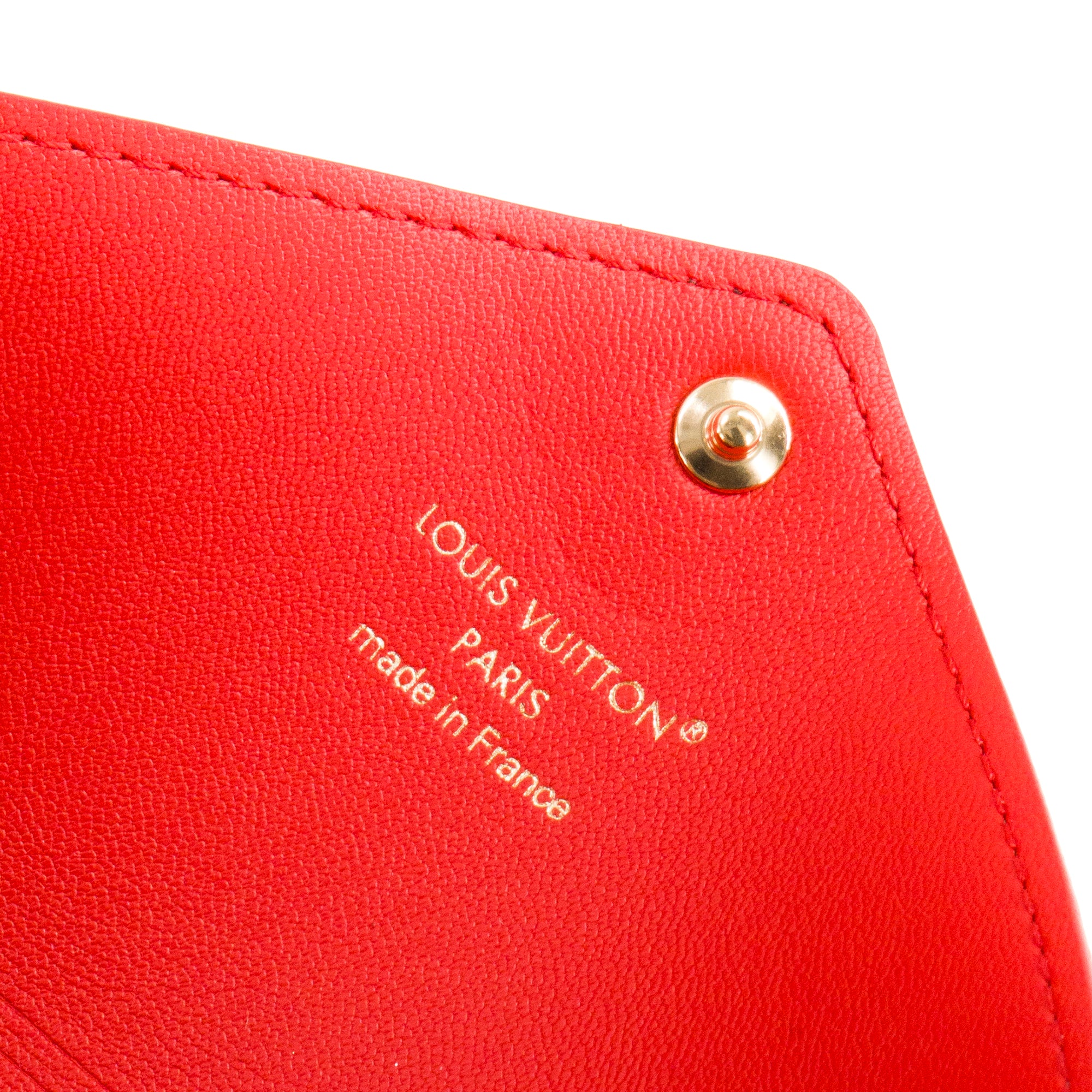 LOUIS VUITTON - Pochette Kirigami MM Louis Vuitton en toile enduite monogrammée