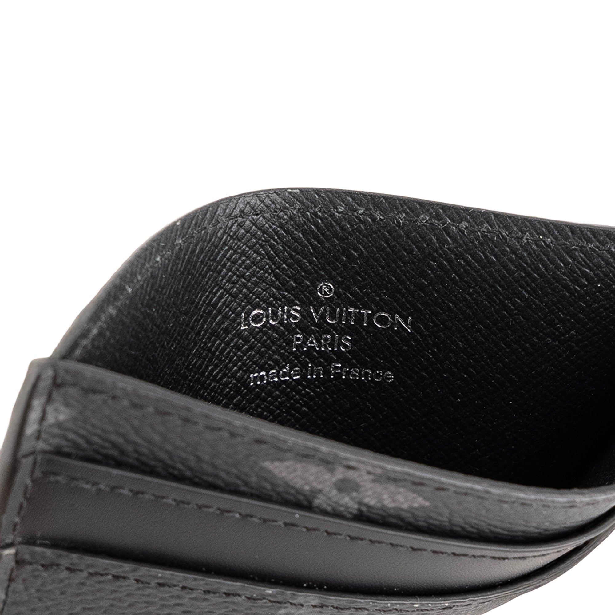 LOUIS VUITTON - Porte cartes Double Louis Vuitton en cuir et toile monogrammée éclipse