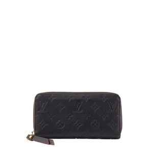 LOUIS VUITTON - Portefeuille Zippy Louis Vuitton en cuir empreinte bleu marine