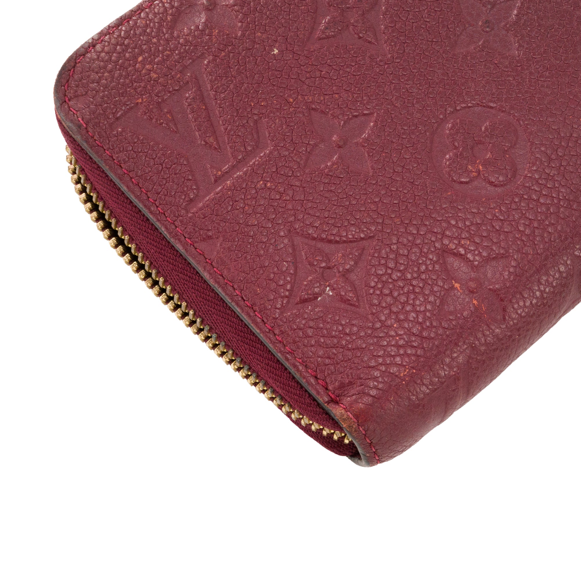 LOUIS VUITTON - Portefeuille Zippy Louis Vuitton en cuir empreinte bordeaux