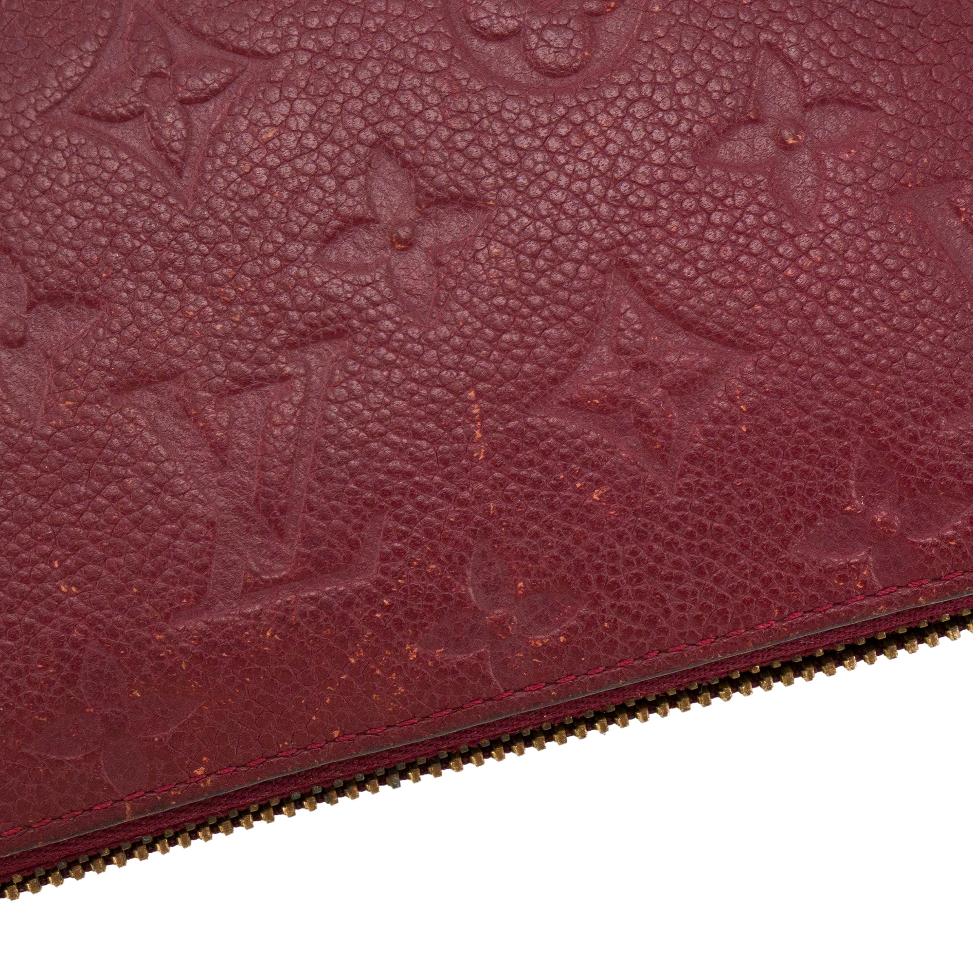 LOUIS VUITTON - Portefeuille Zippy Louis Vuitton en cuir empreinte bordeaux