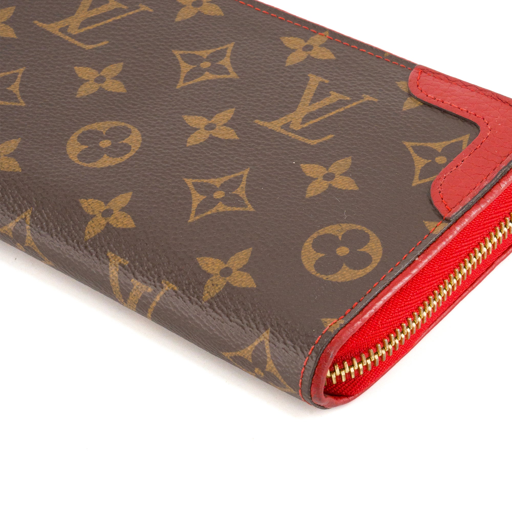 LOUIS VUITTON - Portefeuille Zippy Retiro Louis Vuitton en toile enduite monogrammée et cuir rouge