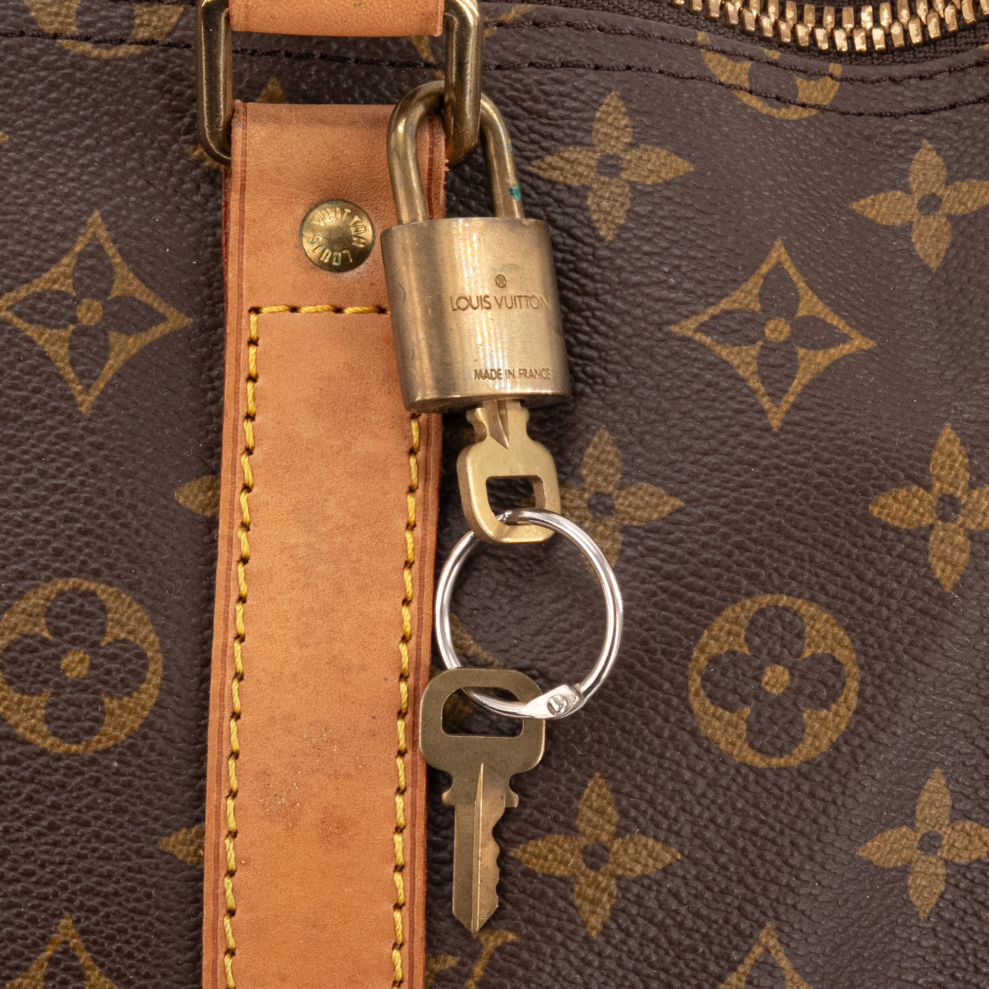 LOUIS VUITTON - Sac de voyage Keepall 55 Louis Vuitton en toile enduite monogrammée vintage