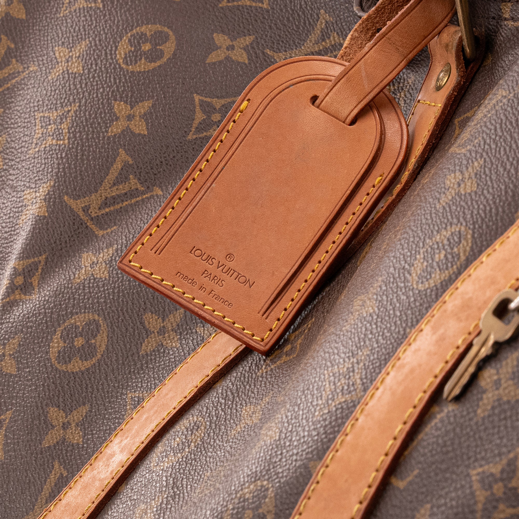 LOUIS VUITTON - Sac de voyage Keepall 55 Louis Vuitton en toile enduite monogrammée vintage