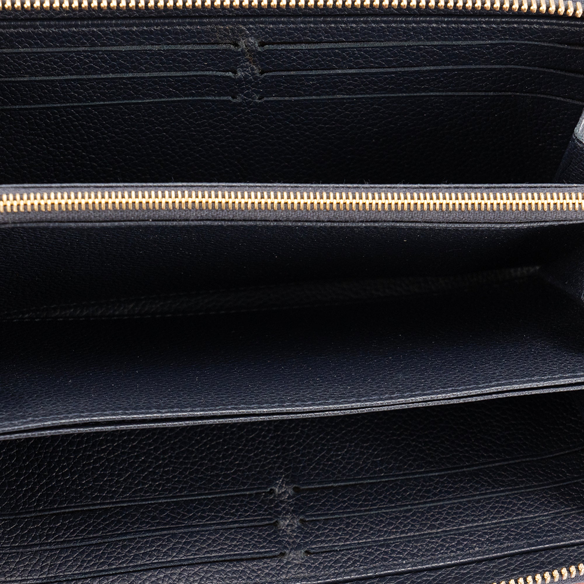 LOUIS VUITTON - Portefeuille Zippy Louis Vuitton en cuir empreinte bleu marine