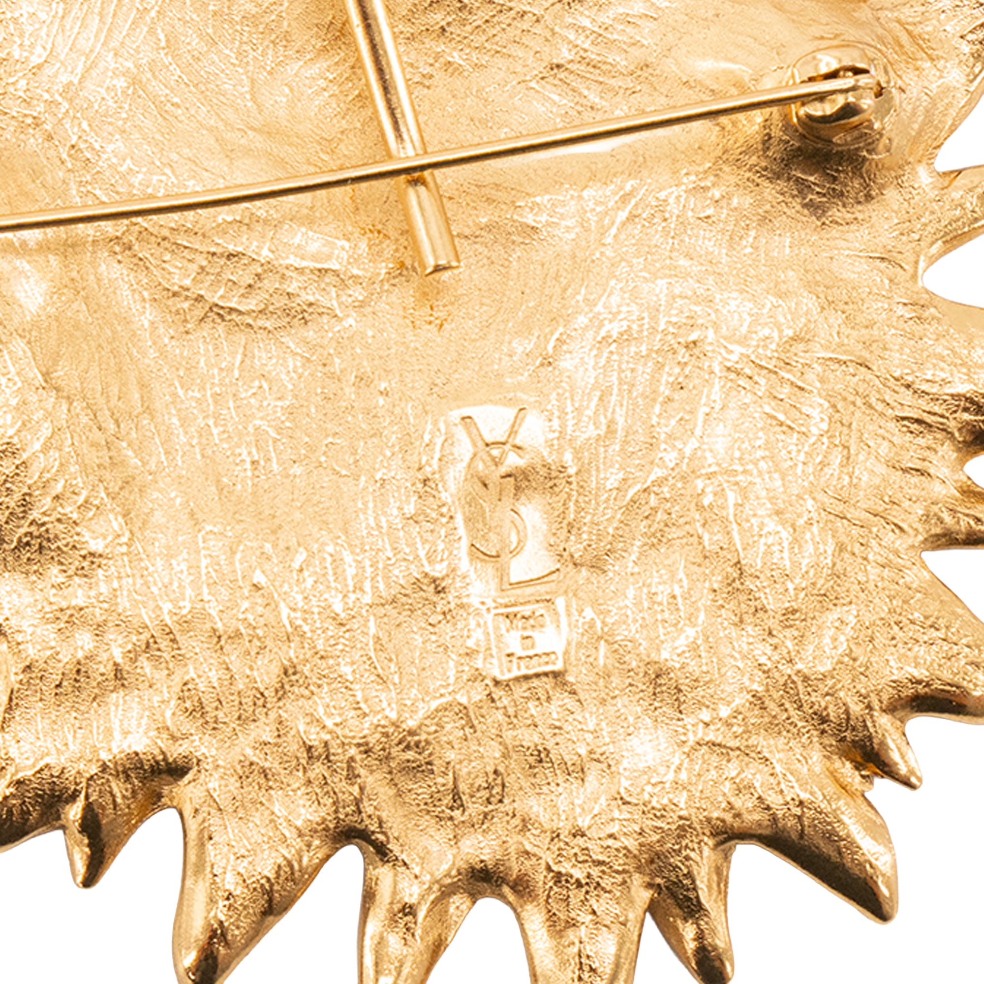 SAINT LAURENT - Broche Visage Soleil Saint Laurent en métal doré