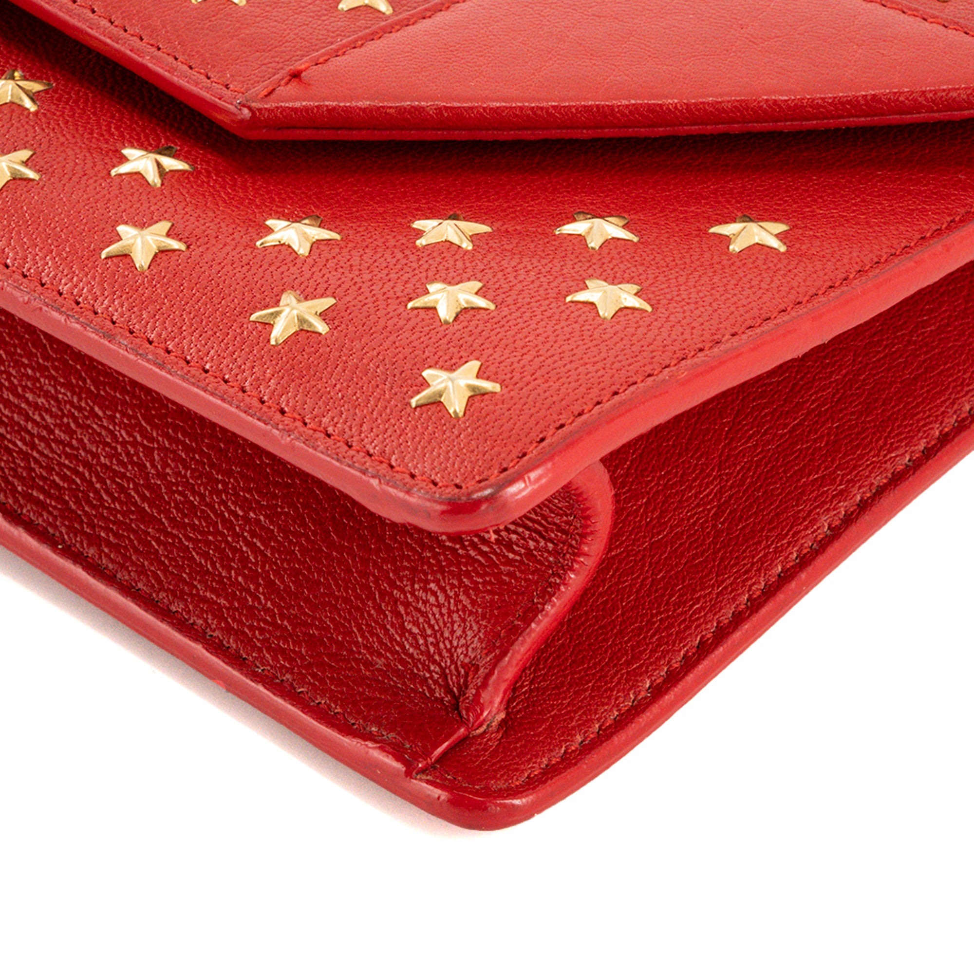 SAINT LAURENT - Pochette Betty Saint Laurent en cuir grainé rouge et clous dorés