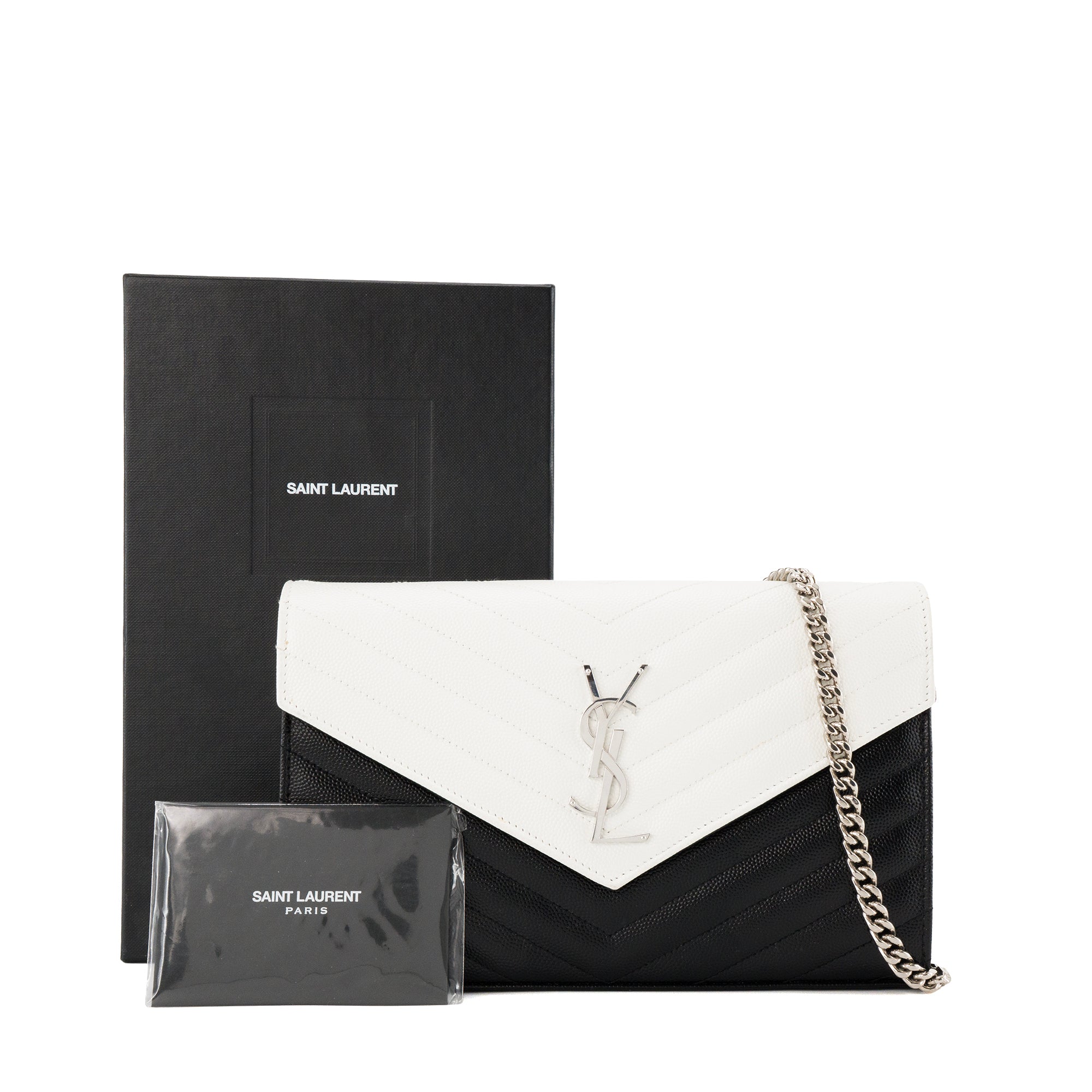 SAINT LAURENT - Sac à bandoulière Cassandre Saint Laurent en cuir bicolore noir et blanc